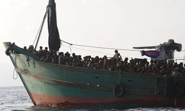 Migrant boat tethered to a Thai navy vessel, in waters near Koh Lipe island. Photograph: Olivia Harris/Reuters 